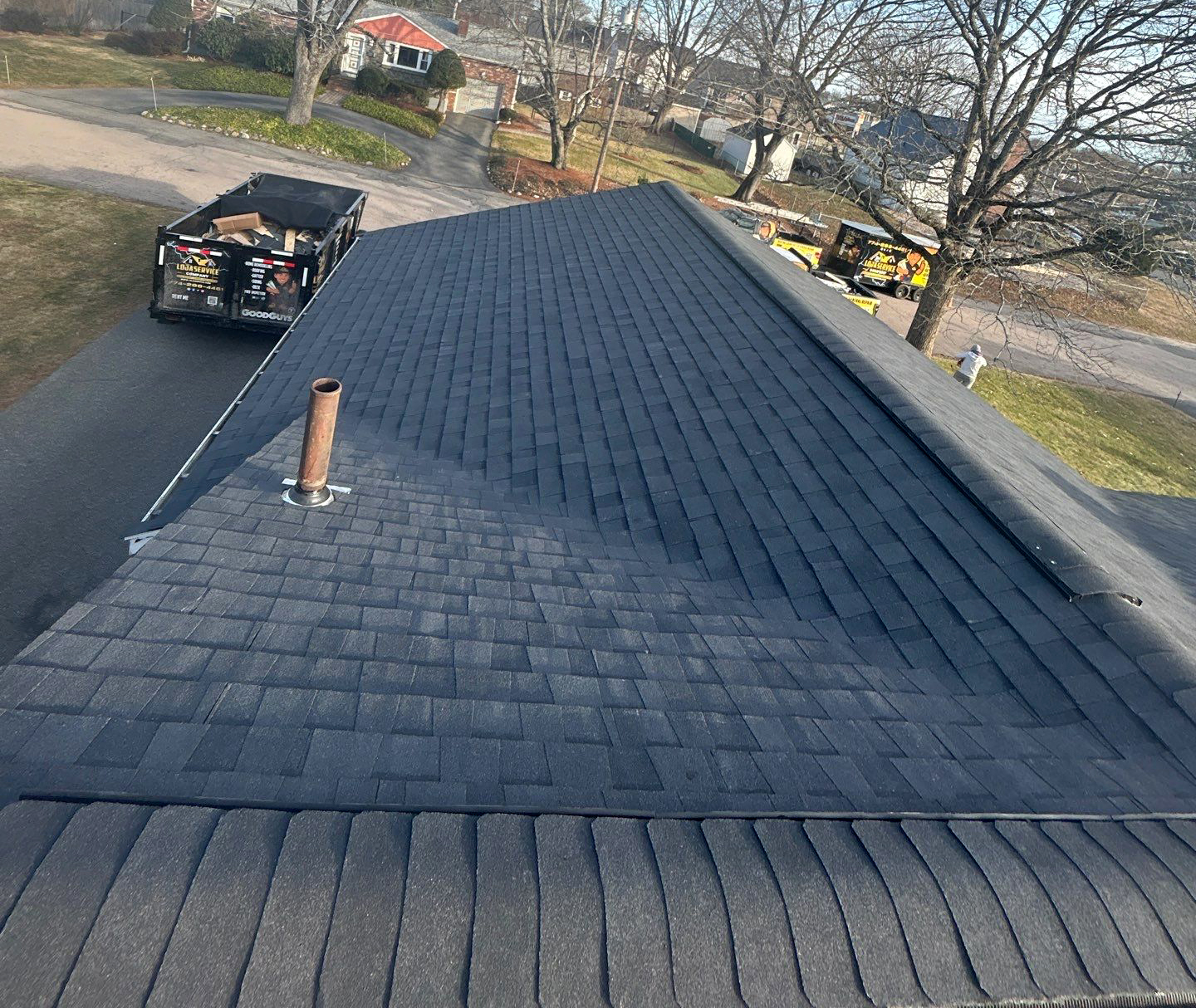Completed general repair roofing project with new dark shingles