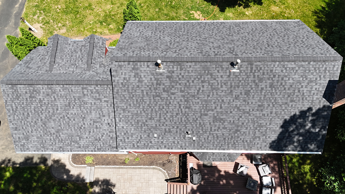 Aerial view of completed architectural shingle residential roof