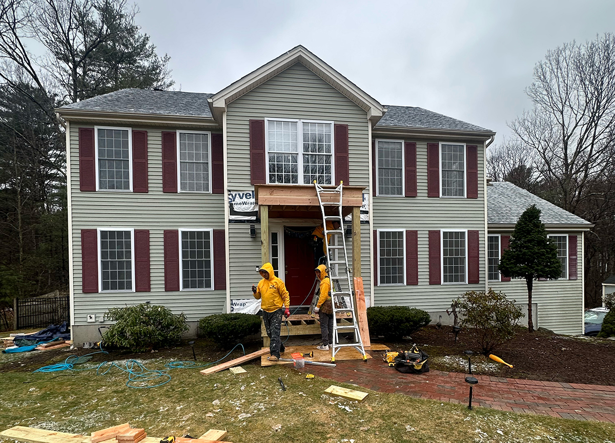 Crew working on a siding installation project
