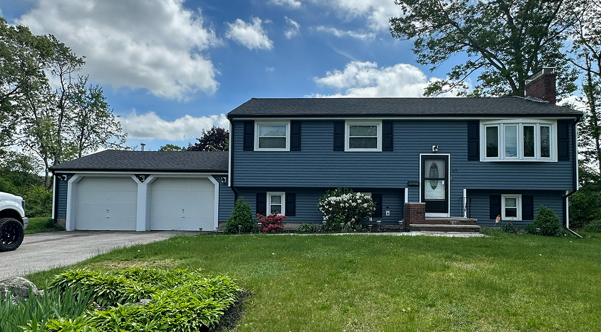 Vinyl siding replacement on a colonial-style home